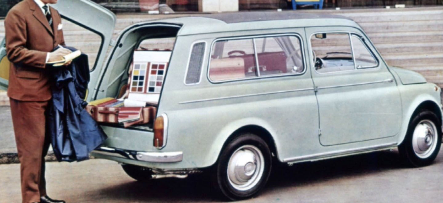 Display A classic drawing of a classic light green Fiat wagon with it's side-opening rear hatch open, revealing a sample case full of color swatches and a man taking notes.